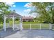Backyard gazebo offering serene views of the manicured lawn and barn at 11250 N 600 W, Fountaintown, IN 46130