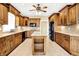 Kitchen featuring wooden cabinets, stainless steel appliances, tile floors, and a center island at 11250 N 600 W, Fountaintown, IN 46130