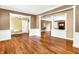 Spacious living room with hardwood floors, decorative columns, and an open design for versatile use at 11250 N 600 W, Fountaintown, IN 46130