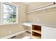 Home office with built-in desk, storage, and a bright window at 11250 N 600 W, Fountaintown, IN 46130