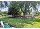 Spacious backyard with a mature trees and a hammock at 11424 Green St, Carmel, IN 46033