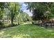 Lush backyard featuring manicured lawn and garden beds at 11424 Green St, Carmel, IN 46033