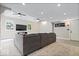 Finished basement with large gray sectional, recessed lighting, and flat screen television at 11424 Green St, Carmel, IN 46033