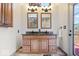 Bathroom vanity featuring double sinks, granite countertops, and modern fixtures at 11424 Green St, Carmel, IN 46033