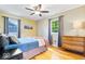 Bedroom featuring hardwood floors, natural light, and ample closet space at 11424 Green St, Carmel, IN 46033