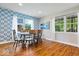 Cozy dining room with stylish wallpaper and natural light at 11424 Green St, Carmel, IN 46033