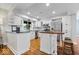 Modern kitchen with white cabinets, stainless steel appliances, and center island at 11424 Green St, Carmel, IN 46033