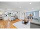 Bright, open living space features hardwood floors, stylish kitchen, and dining area at 11424 Green St, Carmel, IN 46033