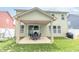 Beautiful backyard with a covered patio, green grass, and plenty of space for outdoor fun at 1156 Brockton Ct, Greenfield, IN 46140