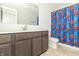 Stylish bathroom with vanity, modern fixtures, and fun Spiderman shower curtain at 1156 Brockton Ct, Greenfield, IN 46140