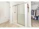 Bright bathroom featuring a glass shower and walk in closet for storing items at 1156 Brockton Ct, Greenfield, IN 46140