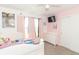 Bright bedroom with a bed, dresser, and curtains at 1156 Brockton Ct, Greenfield, IN 46140