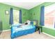 Bright bedroom with a bed, curtains, and green walls at 1156 Brockton Ct, Greenfield, IN 46140