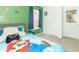 Bright bedroom featuring playful decor, a cozy bed, and a window with natural light at 1156 Brockton Ct, Greenfield, IN 46140
