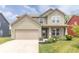Charming two-story home featuring an attached garage and a well-maintained front yard at 1156 Brockton Ct, Greenfield, IN 46140