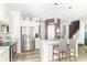 Bright kitchen featuring white cabinets, stainless steel appliances, and a marble countertop island at 1156 Brockton Ct, Greenfield, IN 46140