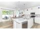 Open-concept kitchen with a center island, stainless steel appliances, and adjacent dining area at 1156 Brockton Ct, Greenfield, IN 46140