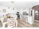 Open-concept kitchen with modern lighting, stainless steel appliances, and a breakfast bar island at 1156 Brockton Ct, Greenfield, IN 46140