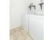 Functional laundry room featuring modern appliances and convenient storage shelves at 1156 Brockton Ct, Greenfield, IN 46140