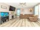 Inviting living room with a fireplace, entertainment center, and a comfortable sectional sofa, perfect for relaxation at 1156 Brockton Ct, Greenfield, IN 46140