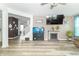 Open-concept living space with modern flooring, fireplace, and entertainment area for Gathering enjoyment at 1156 Brockton Ct, Greenfield, IN 46140