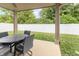 Inviting covered patio with an outdoor dining set, perfect for entertaining and relaxation at 1156 Brockton Ct, Greenfield, IN 46140