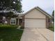 Charming brick and siding home featuring a two-car garage and well-maintained front yard at 11726 Pawleys Ct, Indianapolis, IN 46235