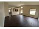 Spacious living room with modern flooring, neutral walls, and bright natural light at 11726 Pawleys Ct, Indianapolis, IN 46235