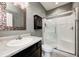 Bathroom with stand up shower with glass doors and a vanity with a decorative mirror at 1187 Blackthorne S Trl, Plainfield, IN 46168
