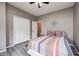 Bedroom with luxury vinyl flooring, closet and ceiling fan, door to the hallway at 1187 Blackthorne S Trl, Plainfield, IN 46168