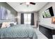 Spacious bedroom with luxury vinyl flooring, ceiling fan, and a TV at 1187 Blackthorne S Trl, Plainfield, IN 46168