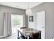 Dining room features a chandelier, slider to the patio, and table with chairs at 1187 Blackthorne S Trl, Plainfield, IN 46168