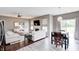 Open concept living room and dining area with slider to the back and comfortable seating at 1187 Blackthorne S Trl, Plainfield, IN 46168