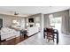 Open-concept living space with hardwood floors, fireplace, adjacent dining area, and plenty of natural light at 1187 Blackthorne S Trl, Plainfield, IN 46168