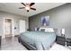 The main bedroom shows the ensuite bathroom, luxury vinyl flooring, and ceiling fan at 1187 Blackthorne S Trl, Plainfield, IN 46168