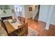 Inviting dining room featuring hardwood floors and an adjacent staircase at 1201 Fantail Dr, Greenwood, IN 46143