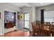 Inviting entryway with wood floors, opening to an office and dining area at 1201 Fantail Dr, Greenwood, IN 46143