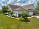 Charming home featuring well-maintained landscaping, lawn, brick accents, and a two-car garage at 1201 Fantail Dr, Greenwood, IN 46143