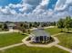 Community gazebo in a park-like setting, with lush green grass and mature trees at 1201 Fantail Dr, Greenwood, IN 46143
