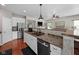 Beautiful kitchen showcasing stainless steel refrigerator and a view into the living room at 1201 Fantail Dr, Greenwood, IN 46143
