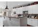 Stylish kitchen with white cabinets, modern appliances, and a breakfast bar at 1201 Fantail Dr, Greenwood, IN 46143