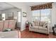 Comfortable sitting area with natural light and neutral tones in a cozy room at 1201 Fantail Dr, Greenwood, IN 46143