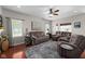 Cozy living room with hardwood floors, comfortable couches, and lots of natural light at 1201 Fantail Dr, Greenwood, IN 46143