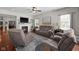 Inviting living room featuring a fireplace, comfortable seating, and natural light at 1201 Fantail Dr, Greenwood, IN 46143