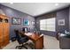 Office space with a desk, office chair, storage cabinet, and natural light from window at 1201 Fantail Dr, Greenwood, IN 46143