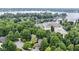 Aerial view highlights lake access, nearby marina, and lush green surroundings at 12214 Ridgeside Rd, Indianapolis, IN 46256