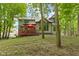 View of backyard and upper deck with outdoor seating, offering a private retreat at 12214 Ridgeside Rd, Indianapolis, IN 46256