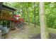 Backyard features a deck, patio, fire pit, and lush landscaping for outdoor living at 12214 Ridgeside Rd, Indianapolis, IN 46256