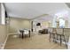 Finished basement features a dining area, bar seating, and a cozy seating area at 12214 Ridgeside Rd, Indianapolis, IN 46256