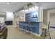 Finished basement features a wet bar with seating and a fireplace at 12214 Ridgeside Rd, Indianapolis, IN 46256